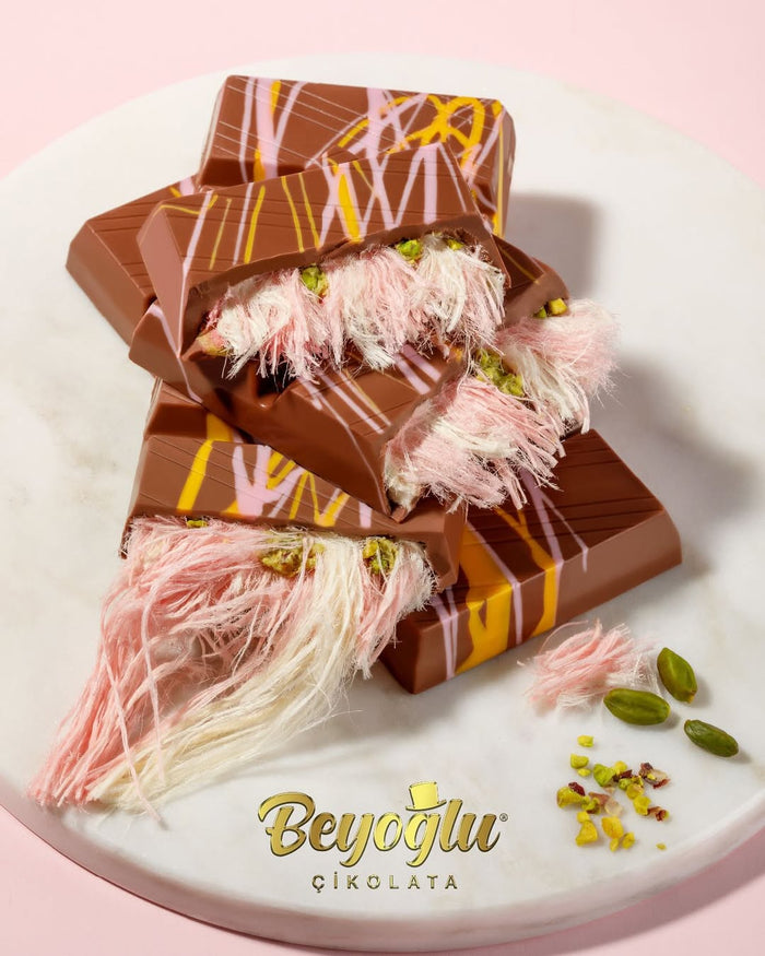 Beyoglu Angel Hair Chocolate bars with decorative elements on a white plate, featuring the brand 'Beyoglu Cikolata'.