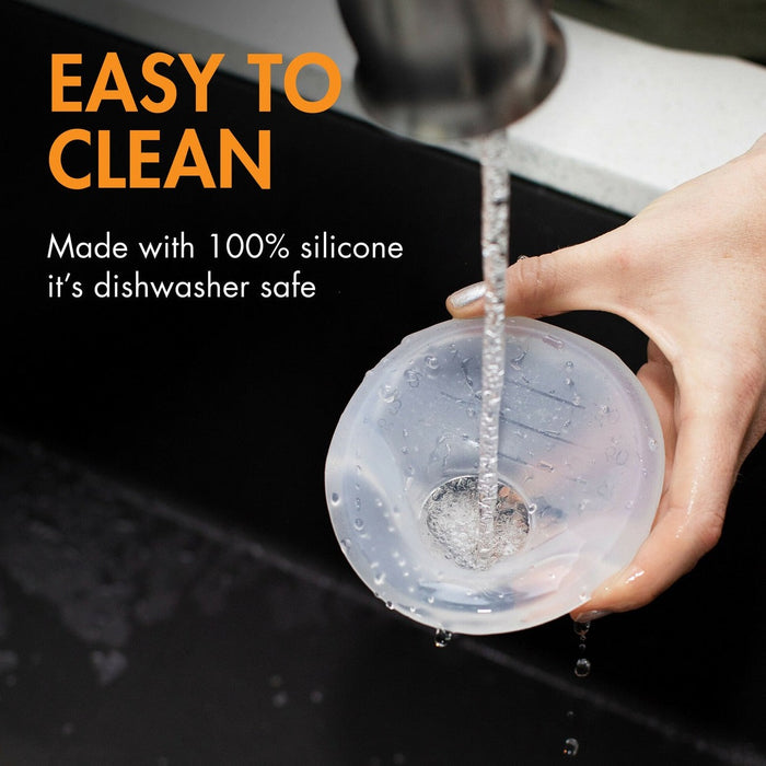 Mom using Boon Trove Passive Silicone Pump - Clear