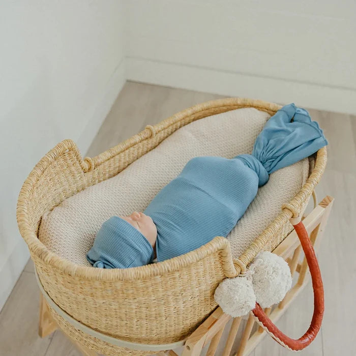 Baby wrapped in Copper Pearl Rib Knit Swaddle Blanket - Atlantic