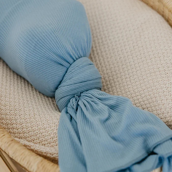 Baby wrapped in Copper Pearl Rib Knit Swaddle Blanket - Atlantic