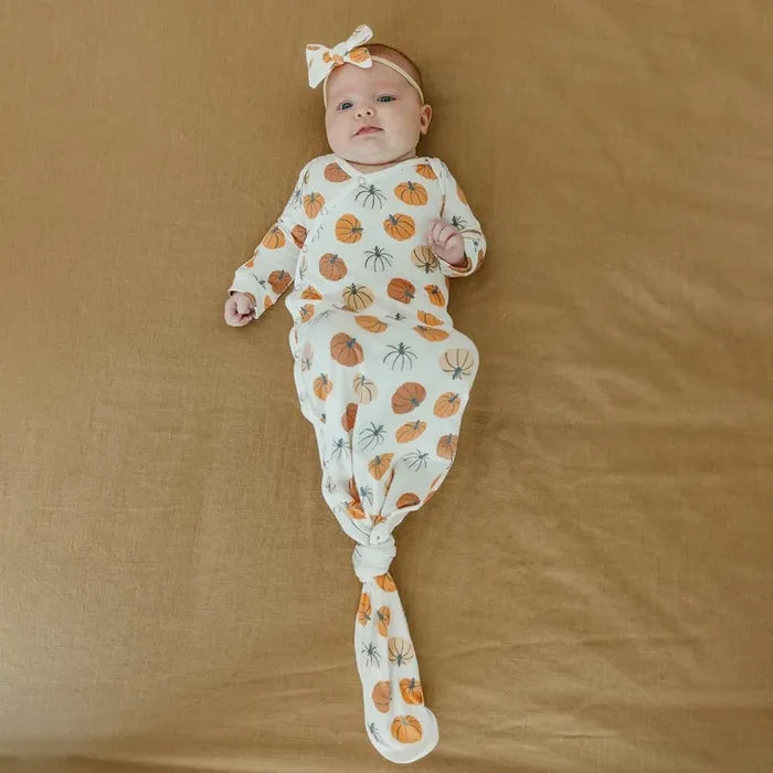 Baby wearing Copper Pearl Seasonal Newborn Knotted Gown - Karver