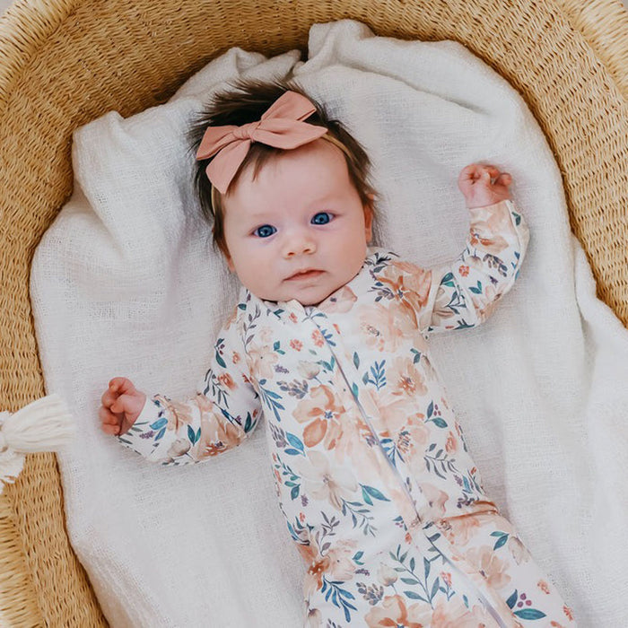 Baby girl wearing Copper Pearl Zip-up Footie - Autumn