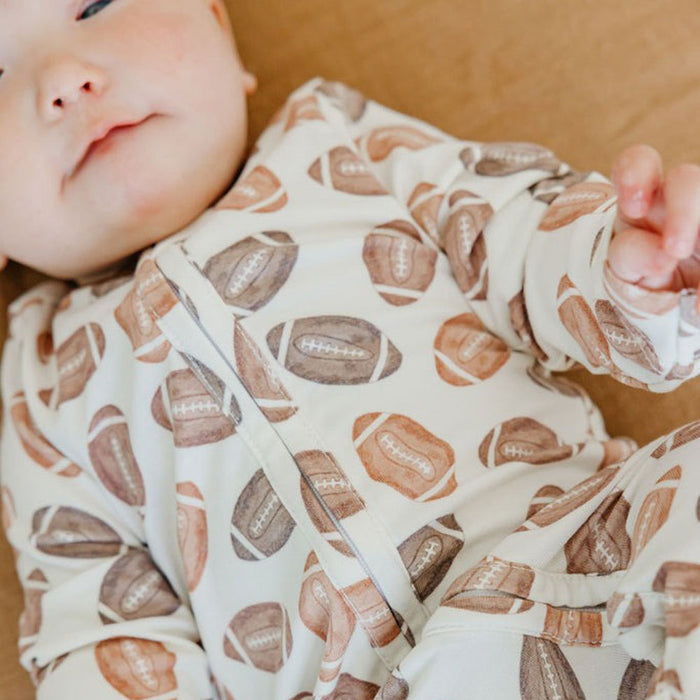 Baby wearing Copper Pearl Zip-up Footie - Blitz