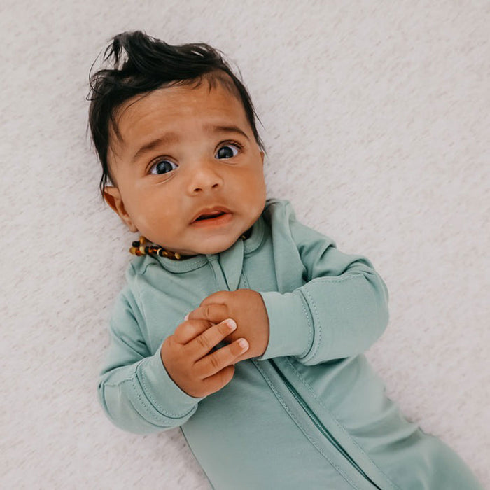 Baby wearing Copper Pearl Zip-up Footie - Briar