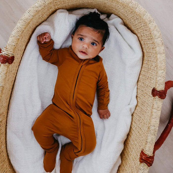 Baby wearing Copper Pearl Zip-up Footie - Camel