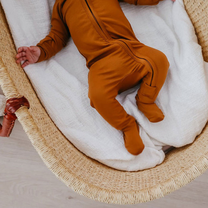 Baby wearing Copper Pearl Zip-up Footie - Camel