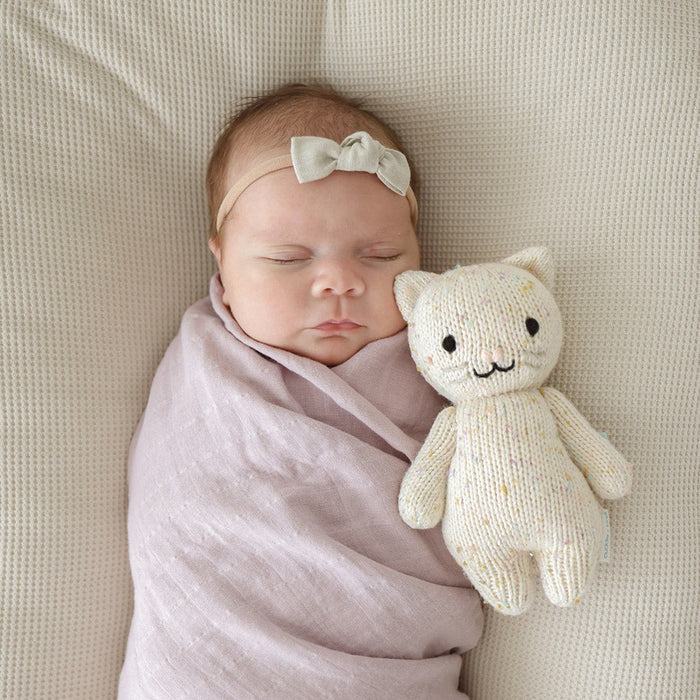 Baby sleeping next to Cuddle and Kind Baby Kitten - Confetti