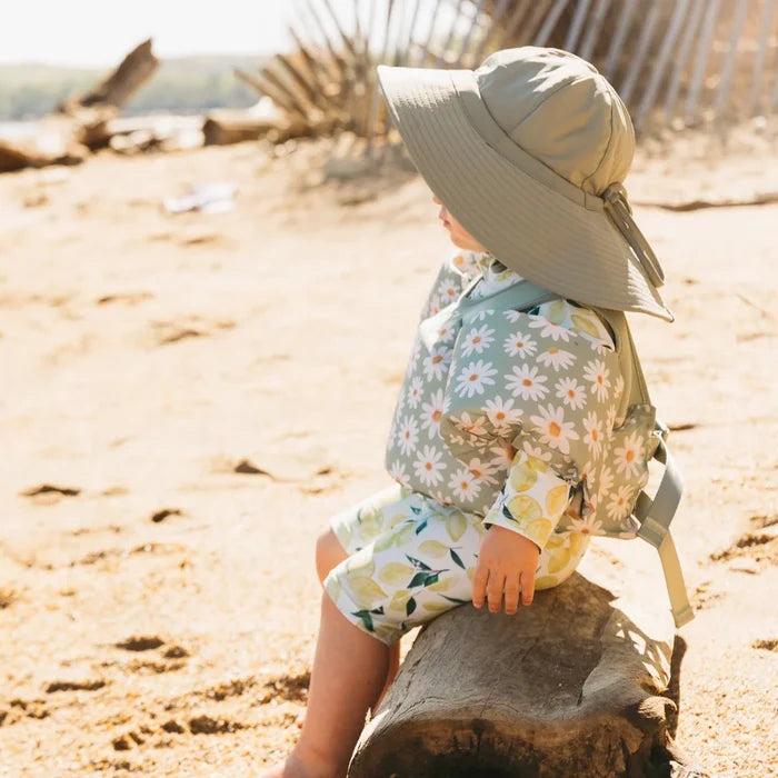 Baby at the beach wearing Current Tyed Clothing Swim Floaties - Sage Daisies