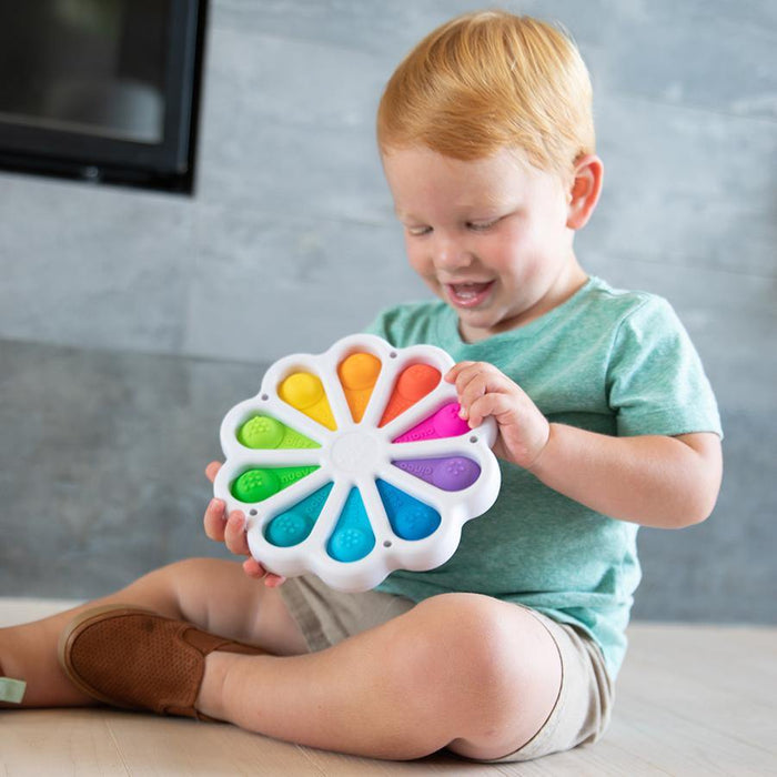 Child Playing with Fat Brain Toys Dimpl Digits