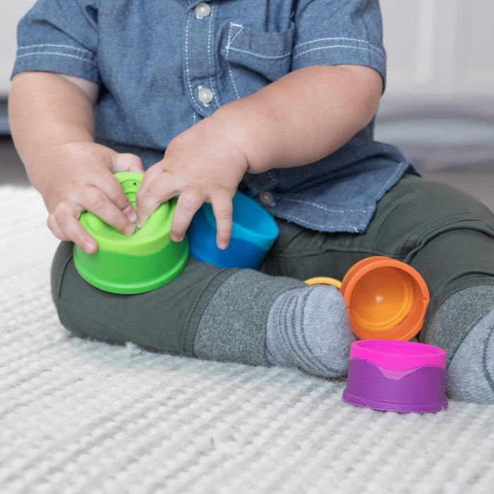Toddler playing with Fat Brain Toys Dimpl Stack