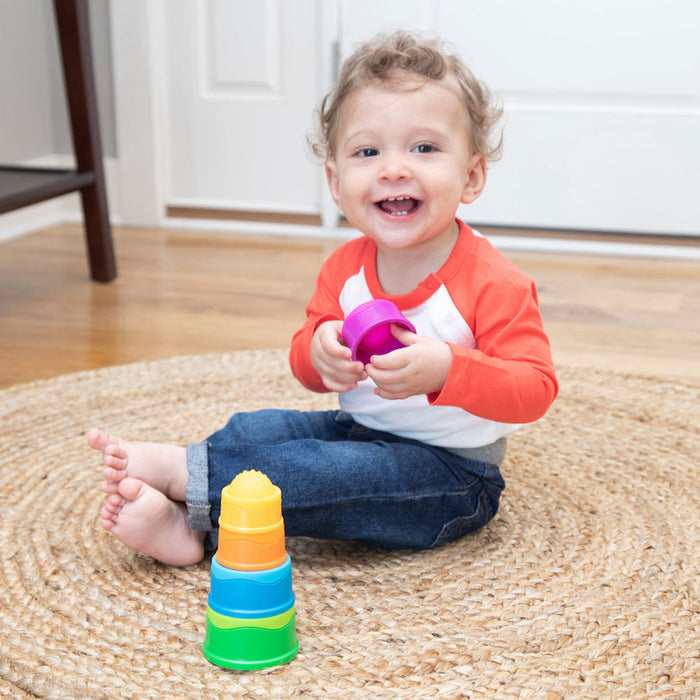 Toddler playing with Fat Brain Toys Dimpl Stack