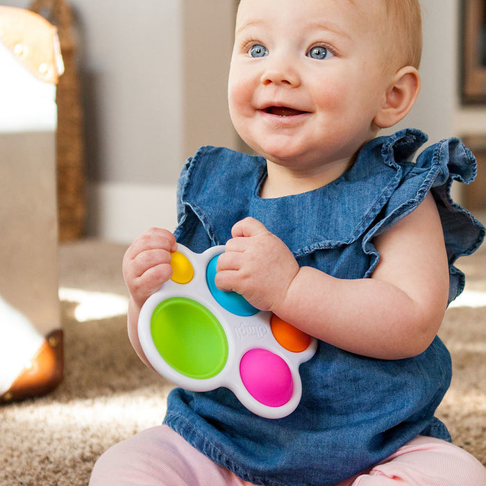 Child Playing with Fat Brain Toys Dimpl