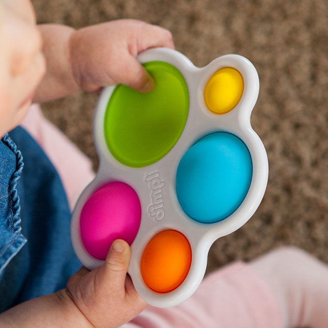 Child Playing with Fat Brain Toys Dimpl