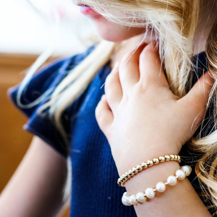 Little girl wears Joyful Bead Company Fancy Pearl Bracelet