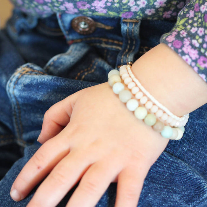 Little girl wearing Joyful Bead Company Frosted Blaire Bracelet