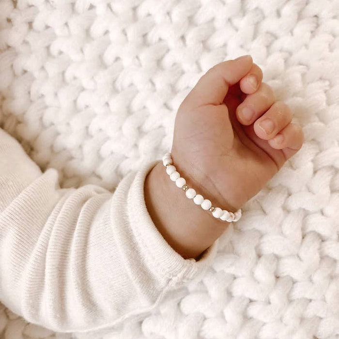 Baby wearing Joyful Bead Company Goldie Dot Bracelet