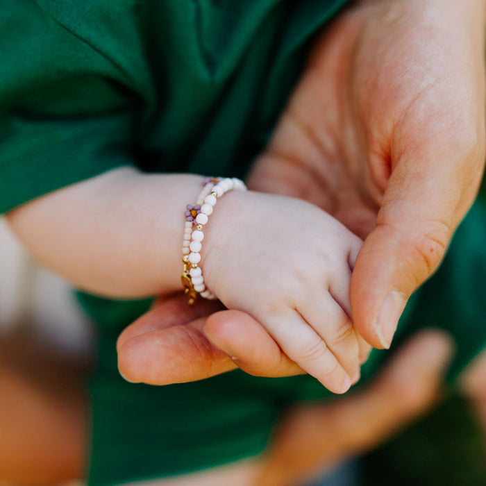Baby wearing Joyful Bead Company Goldie Dot Bracelet
