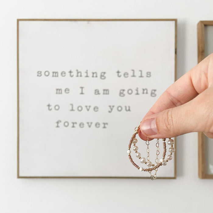 Woman holds Joyful Bead Company Hazelnut Bracelet
