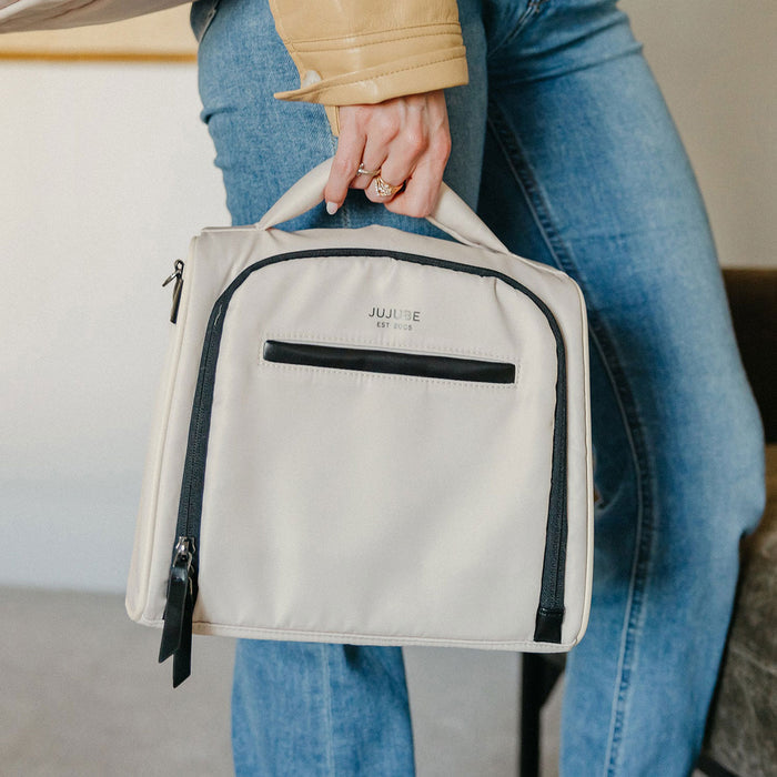 Woman holding JuJuBe Insulated Bottle Bag - Witney Carson - Cloud