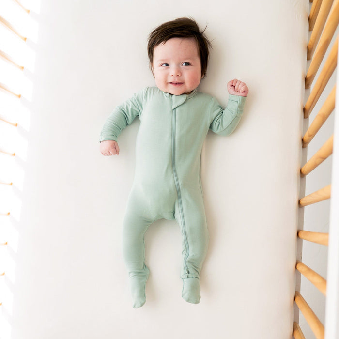 Baby wearing Kyte BABY Zippered Footie - Sage