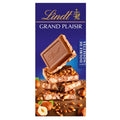 Experience the luxurious taste of Lindt Hazelnut Caramel Milk Chocolate Bar with Hazelnut Pieces, crafted with premium Swiss chocolate and 15% roasted hazelnuts.