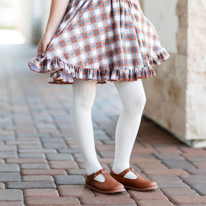 Little girl wearing Little Stocking Co Ribbed Knit Tights - Ivory