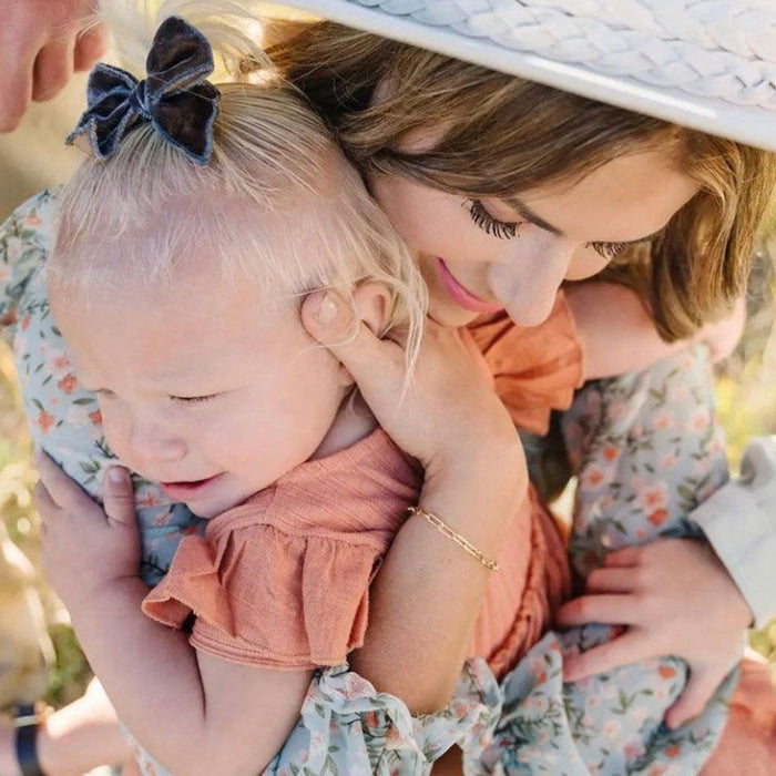 Mom hugs child while wearing LittleLundsCo Bracelet - Paper Clip Chain