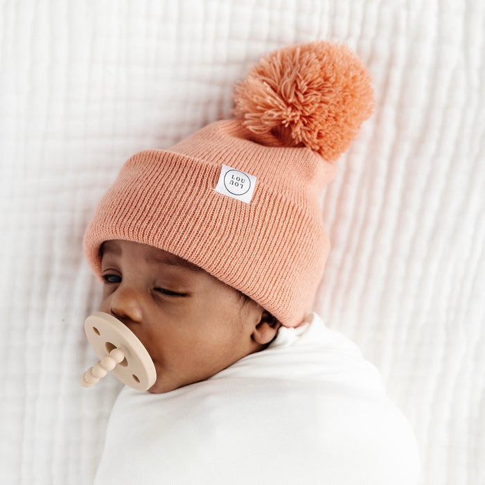 Baby wearing Lou Lou and Company Beanie