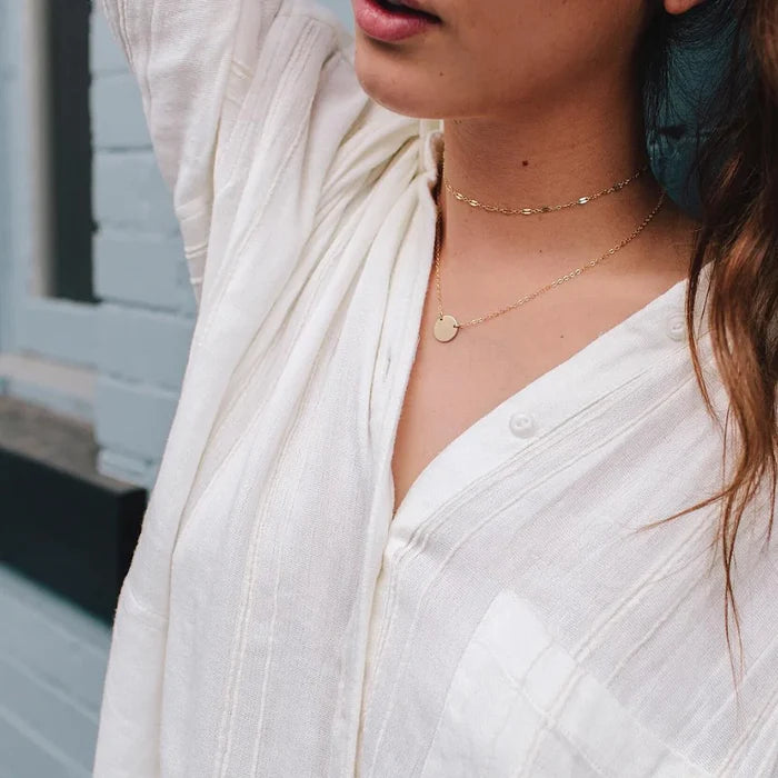 Woman Wearing Made by Mary Gold Filled Mini Zola Disc Necklace - April / Daisy
