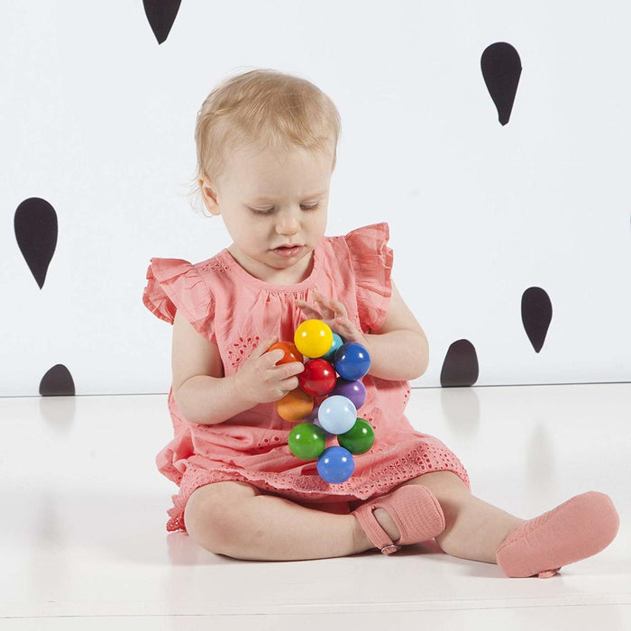 Toddler Playing with Manhattan Toy Company Baby Beads - Classic