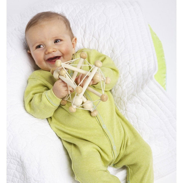 Baby playing with Manhattan Toy Company Skwish - Natural