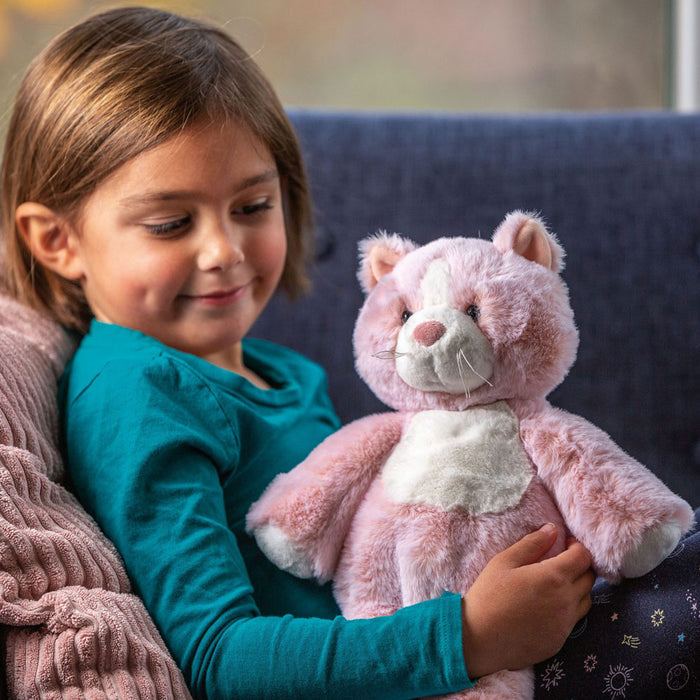 Little girl smiles at Mary Meyer Marshmallow Rosie Kitty