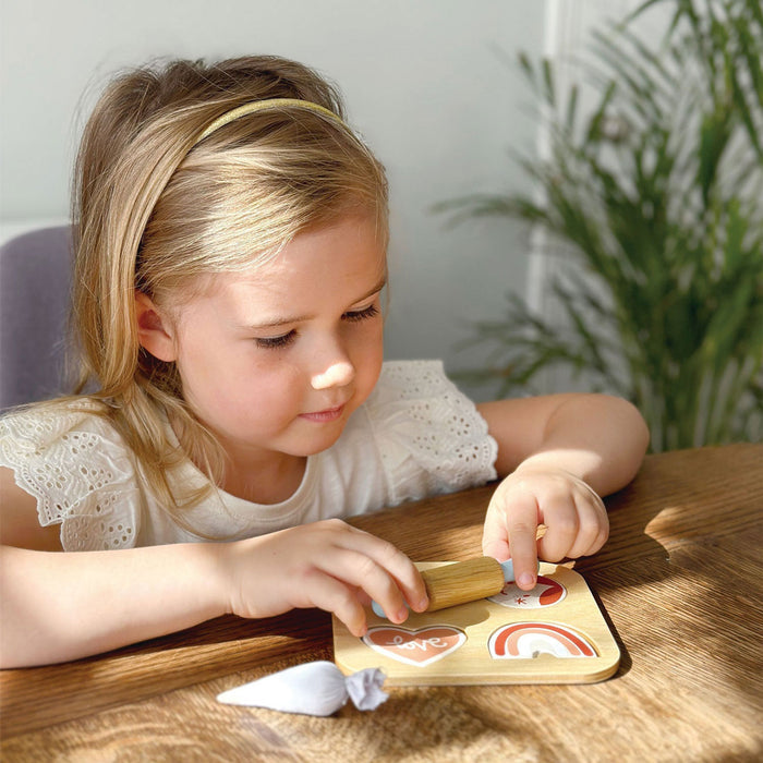 Little girl plays with Mentari Toys Cookie Cutting Set