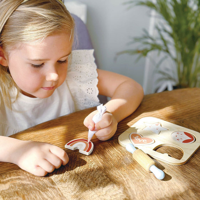 Little girl plays with Mentari Toys Cookie Cutting Set