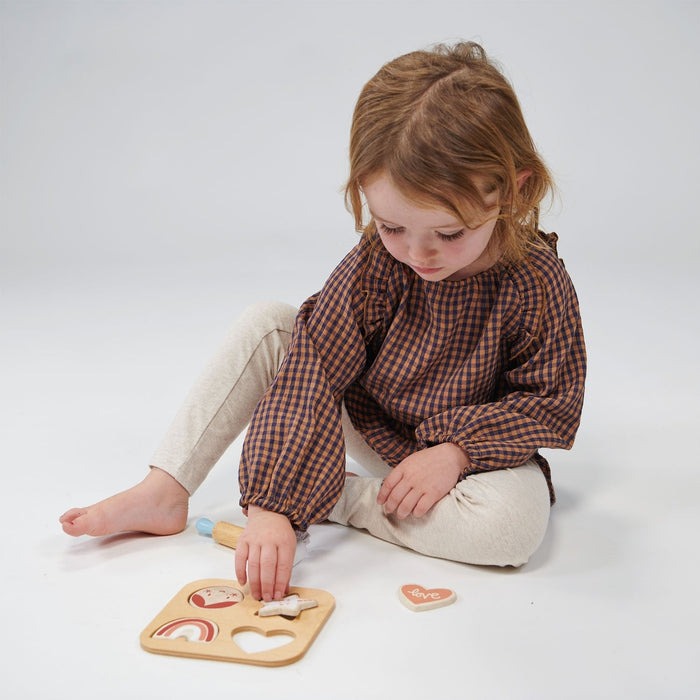 Child plays with Mentari Toys Cookie Cutting Set