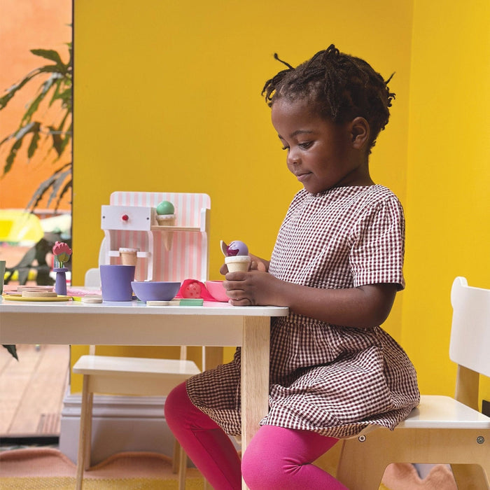Little girl playing with Mentari Toys Ice Cream Kiosk