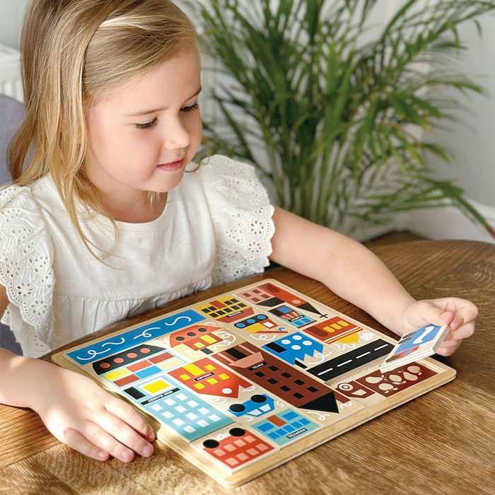 Little girl plays with Mentari Toys Town Puzzle