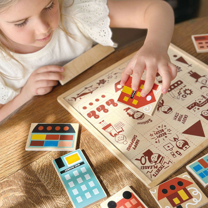 Little girl plays with Mentari Toys Town Puzzle