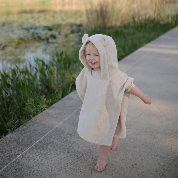 Toddler wearing Mushie Bear Poncho Towel - Fog
