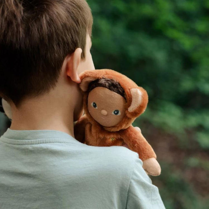 Boy holding Olli Ella Dinky Dinkums Doll - Bobby Bear
