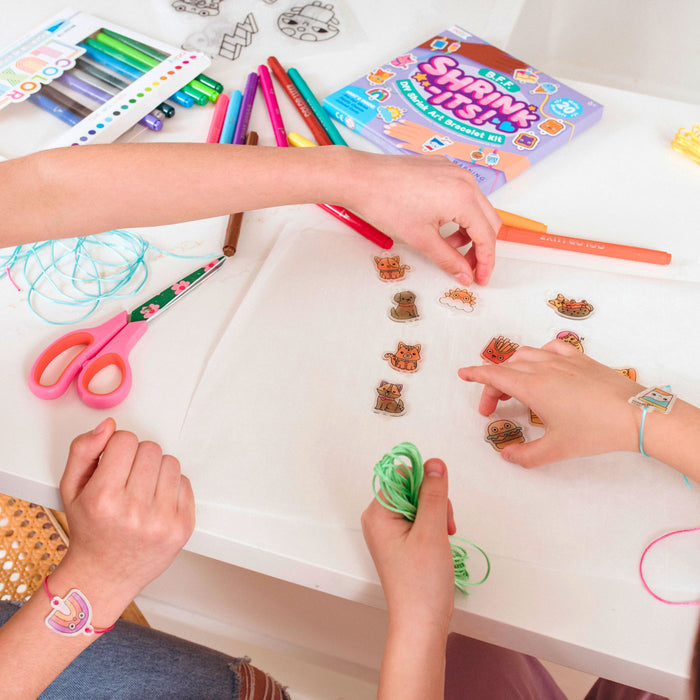 Girls making OOLY Shrink-its! DIY Shrink Art Kit - BFF Bracelet