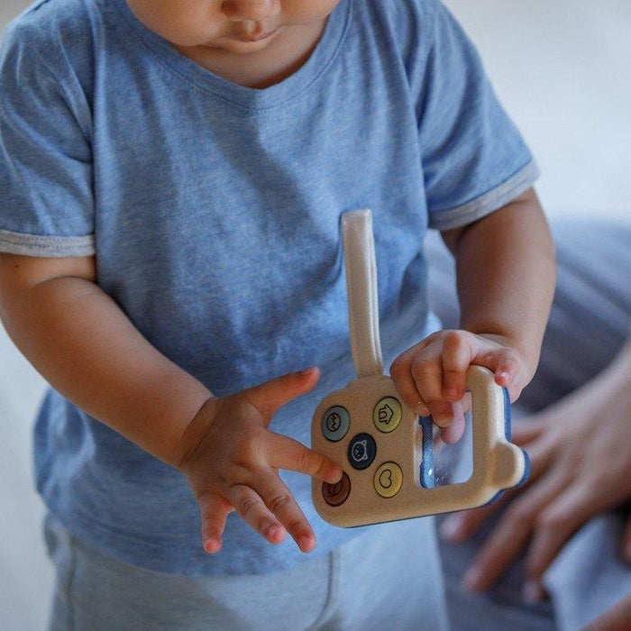 Toddler Playing with PlanToys My First Phone - Orchard Series
