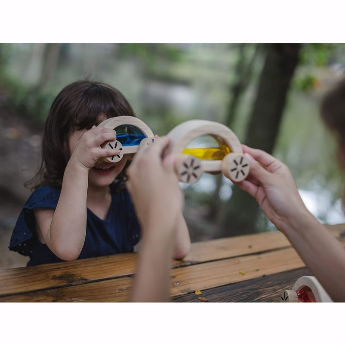Child  plays with PlanToys Wautomobile