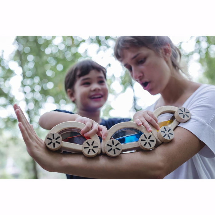 Child  plays with PlanToys Wautomobile