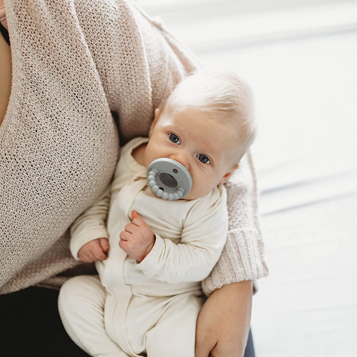 Baby sucking on Ryan and Rose Cutie PAT Kit - Neutral Kit