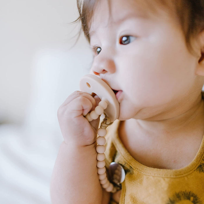 Toddler sucking on Ryan and Rose Cutie PAT Kit - Neutral Kit