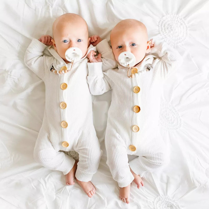 Twin babies sucking on Ryan and Rose Flat Cutie PAT Pacifier 2 Pack - Grey / White