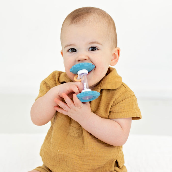Baby chews on Ryan and Rose Gear Teether Rattle Toy - Oxford