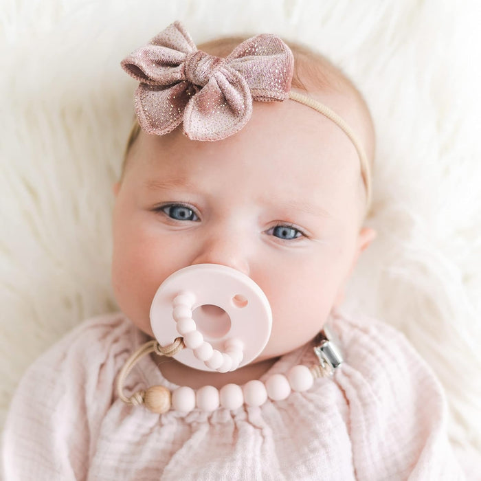 Baby sucks on Ryan and Rose Round Cutie PAT Pacifier 2 Pack - Pink / Rose - Stage 1