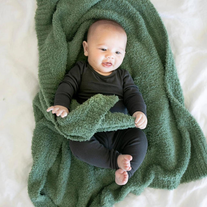 Baby laying on Saranoni Receiving Bamboni Blanket - Olive